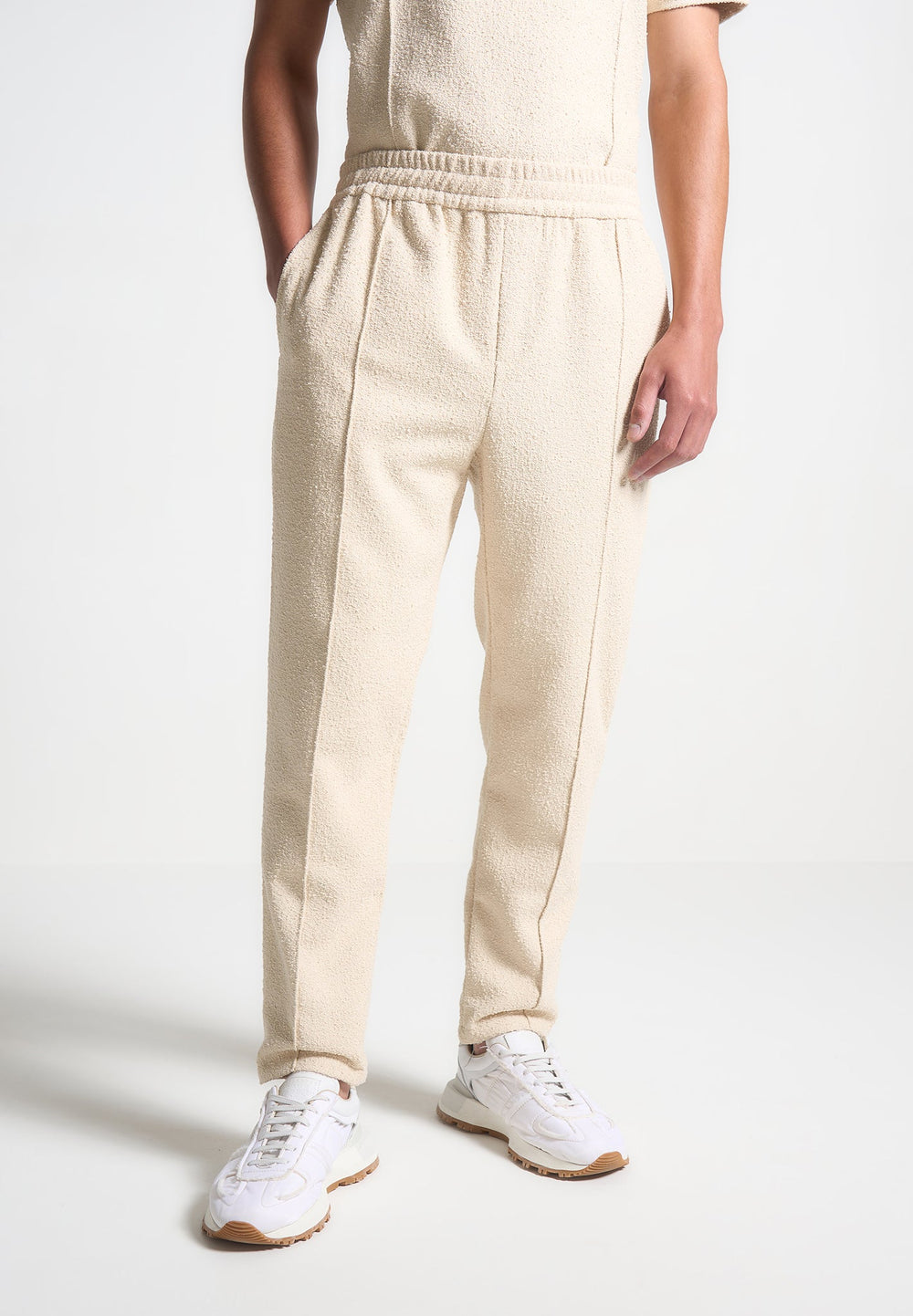 boucle-pintuck-tapered-trousers-beige